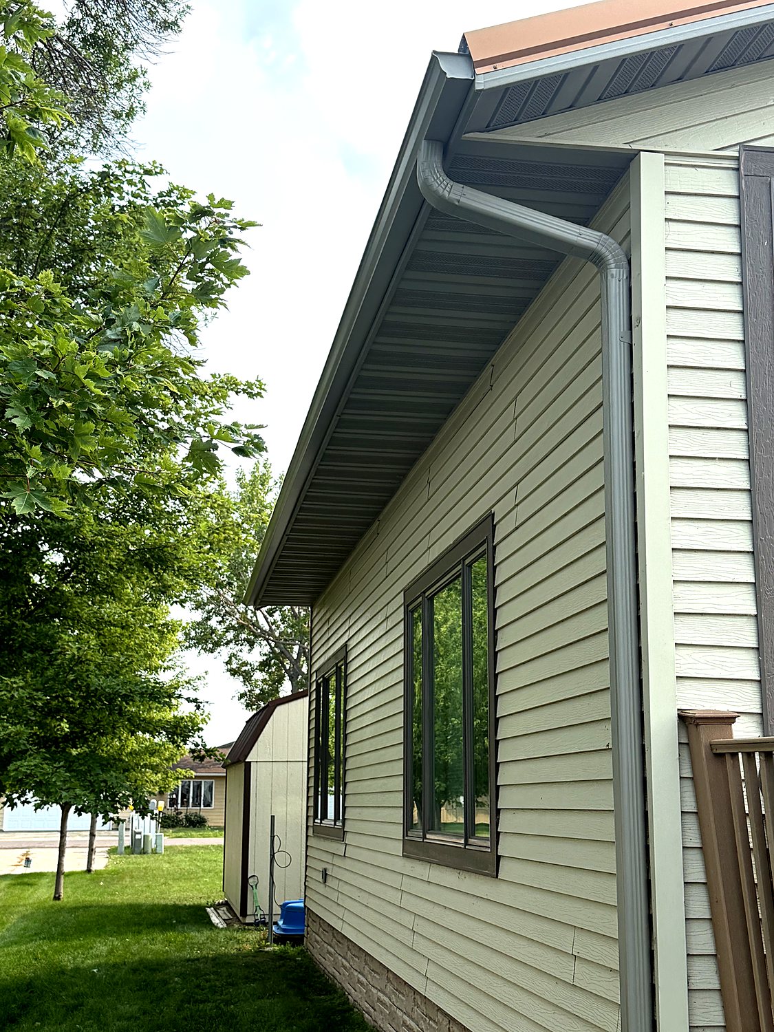 Downspout and elbow running clean to grade